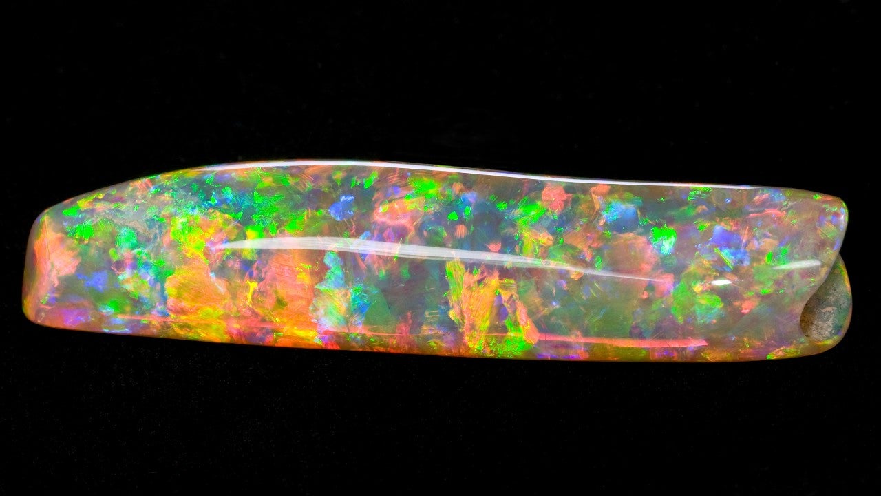 The Virgin Rainbow – an opalised belemnite. Photograph: courtesy of Denis Smith The Virgin Rainbow – an opalised belemnite